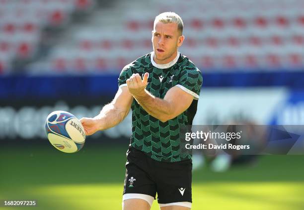 Gareth Davies passes the ball during the Wales training session ahead of their Rugby World Cup France 2023 match against Portugal at Stade de Nice on...