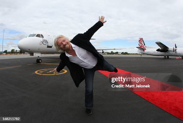 Sir Richard Branson poses in front of an aircraft at Perth Airport on May 7, 2013 in Perth, Australia. Virgin Australia purchased Perth-based...