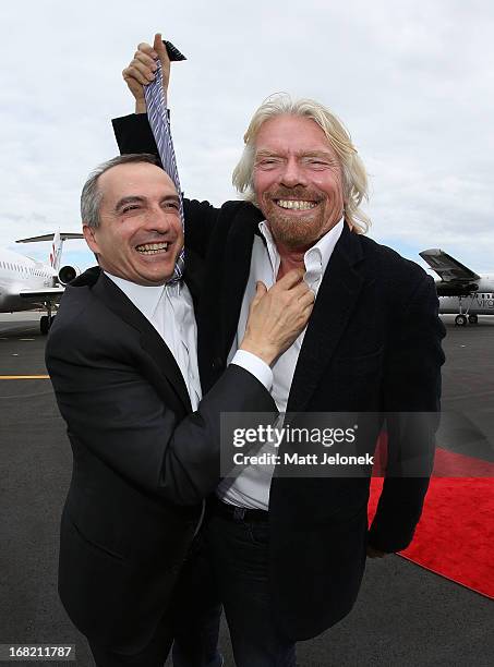 Virgin CEO John Borghetti and Sir Richard Branson pose at Perth Airport on May 7, 2013 in Perth, Australia. Virgin Australia purchased Perth-based...