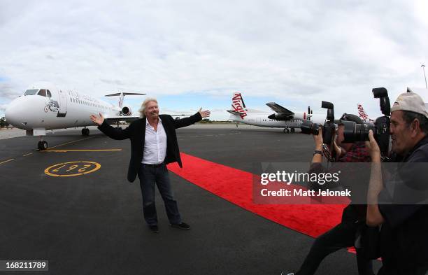 Sir Richard Branson poses in front of an aircraft at Perth Airport on May 7, 2013 in Perth, Australia. Virgin Australia purchased Perth-based...