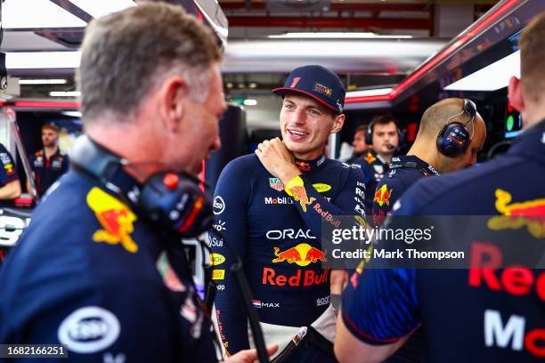 Max Verstappen of the Netherlands and Oracle Red Bull Racing talks with Red Bull Racing Team Principal Christian Horner in the garage during practice...