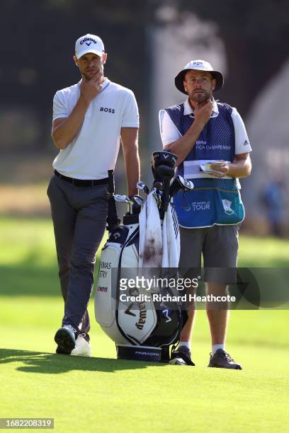 Thomas Detry of Belgium and his caddie, Lee Warne prepare on the 6th hole on Day Two of the BMW PGA Championship at Wentworth Golf Club on September...