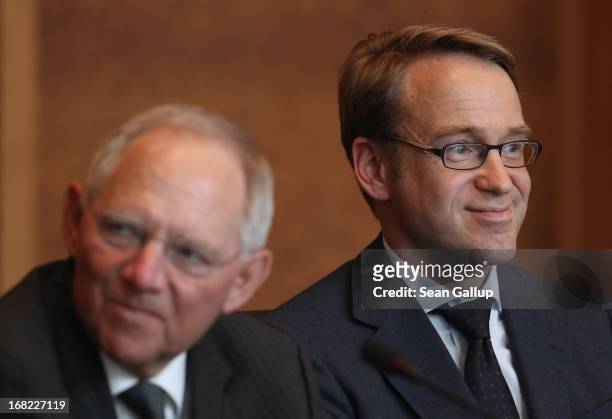 German Finance Minister Wolfgang Schaeuble and Bundesbank head Jens Weidmann attend a discussion with students during events marking the 25th...