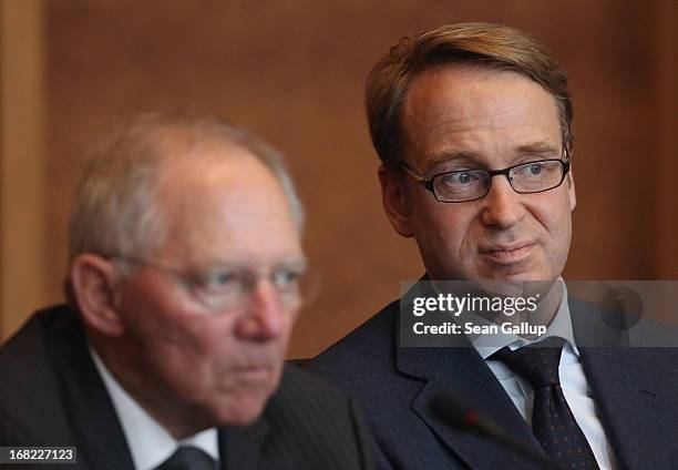 German Finance Minister Wolfgang Schaeuble and Bundesbank head Jens Weidmann attend a discussion with students during events marking the 25th...