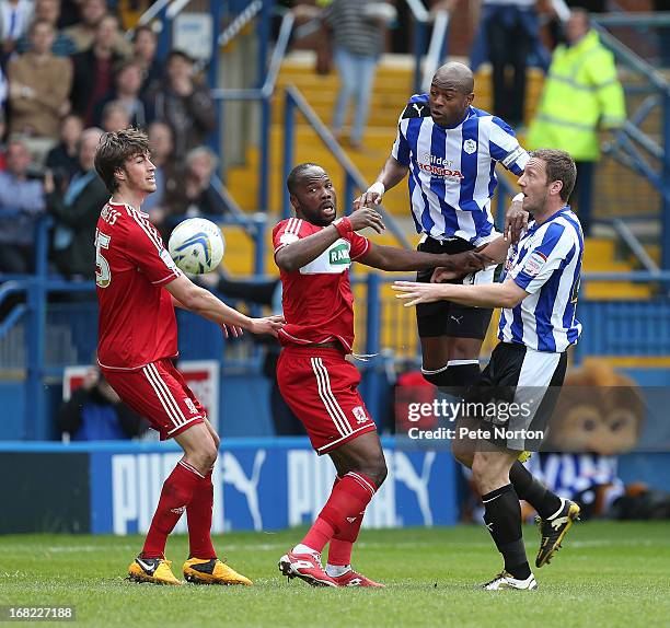 Anthony Gardner and Steve Howard of Sheffield Wednesday contest the ball with Andre Bikey and Christian Burgess of Middlesbrough during the npower...