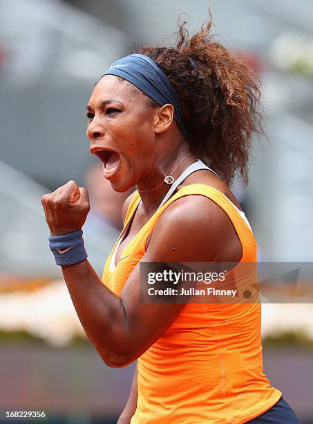 Serena Williams of USA celebrates winning a point in her match against Lourdes Dominguez Lino of Spain during day four of the Mutua Madrid Open...