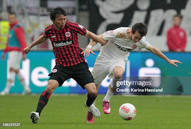 Inui Takashi of Frankfurt challenges Robbie Kruse of Duesseldorf during the Bundesliga match between Eintracht Frankfurt and Fortuna Duesseldorf 1895...