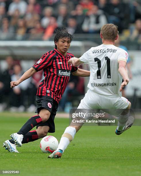 Inui Takashi of Frankfurt challenges Axel Bellinghausen of Duesseldorf during the Bundesliga match between Eintracht Frankfurt and Fortuna...