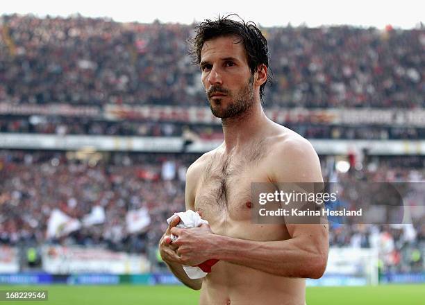 Jens Langeneke of Duesseldorf wants to give away his jersey during the Bundesliga match between Eintracht Frankfurt and Fortuna Duesseldorf 1895 at...