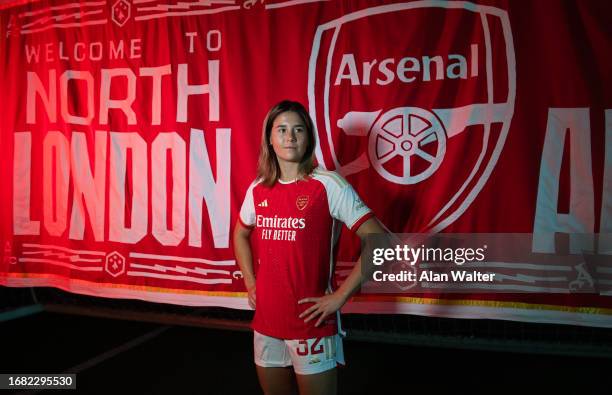 Kyra Cooney-Cross signs for Arsenal Women at the Arsenal Training Ground at London Colney on September 14, 2023 in St Albans, England.
