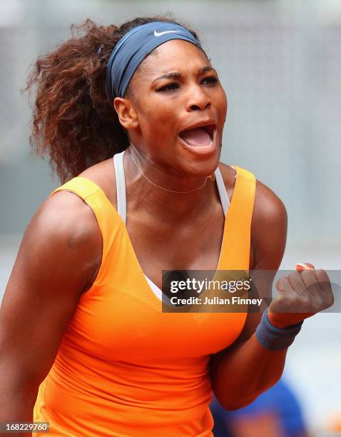 Serena Williams of USA celebrates winning at match point in her match against Lourdes Dominguez Lino of Spain during day four of the Mutua Madrid...