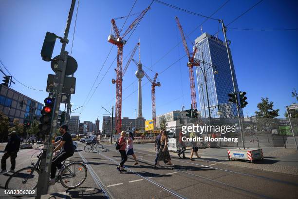 Cranes on a construction site at Alexanderplatz in Berlin, Germany, on Thursday, Sept. 21, 2023. German industrial output fell again in July, further...