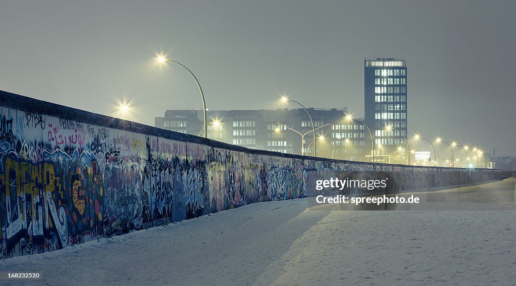 Berlin wall at winter with mist an nightlights