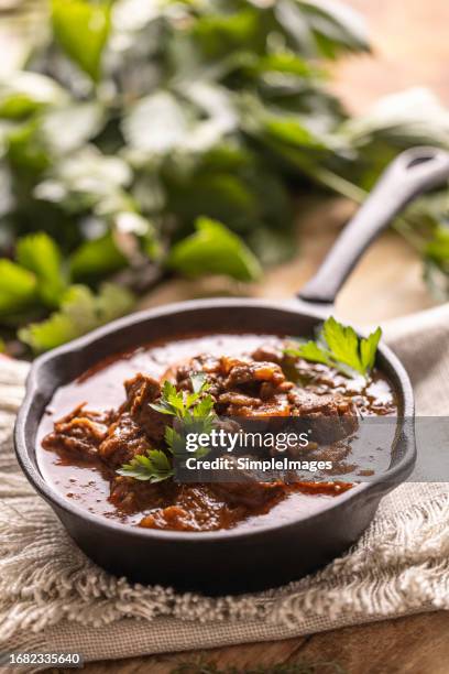 traditional viennese goulash in a pan. - beef bourguignon stock pictures, royalty-free photos & images