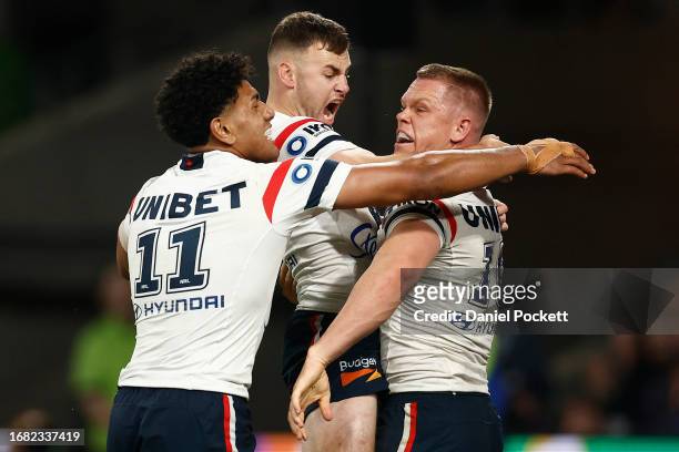 Lindsay Collins of the Roosters celebrates with team mates after scoring a try during the NRL Semi Final match between Melbourne Storm and the Sydney...