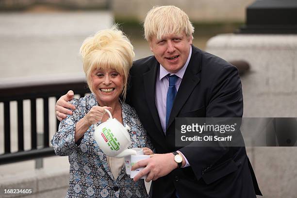 Boris Johnson, the Mayor of London, and actress Barbara Windsor promote 'The Big Lunch' outside City Hall on May 7, 2013 in London, England. The...