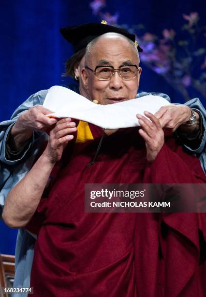 Tibetan spiritual leader the Dalai Lama receives an honorary doctorate after delivering the Sadat Lecture for Peace, entitled "Peace Through...