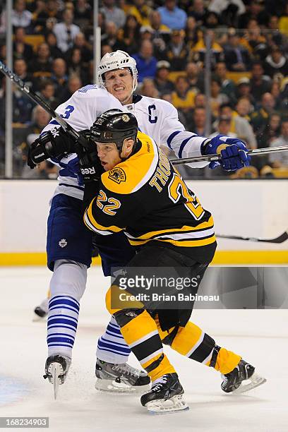 Shawn Thornton of the Boston Bruins skates against Dion Phanuef of the Toronto Maple Leafs in Game One of the Eastern Conference Quarterfinals during...