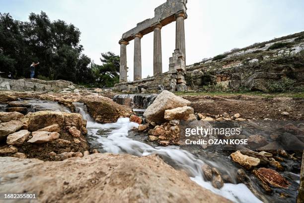 Water flows through the ruins at the site of the ancient Greco-Roman city of Cyrene in eastern Libya, about 60 kilometres west of Derna, on September...