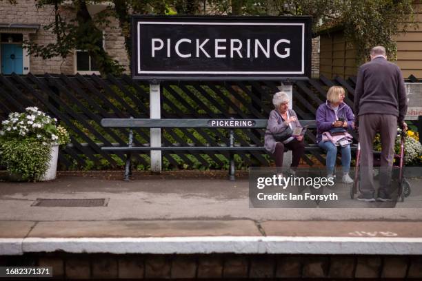 Passengers wait for their train at the North Yorkshire Moors Railway station at Pickering on September 15, 2023 in Pickering, England. The Caledonian...