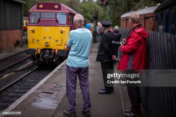 Visitors watch as a diesel locomotive arrives at the North Yorkshire Moors Railway station at Pickering on September 15, 2023 in Pickering, England....