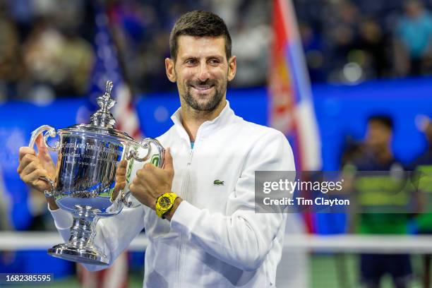 September 10: Novak Djokovic of Serbia with the winners' trophy after his 24th grand slam victory against Daniil Medvedev of Russia in the Men's...