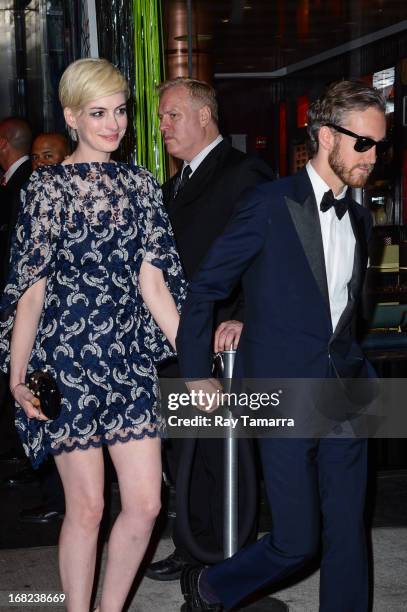 Actress Anne Hathaway and Adam Shulman leave the "PUNK: Chaos To Couture" Costume Institute Gala after party at the Standard Hotel on May 6, 2013 in...