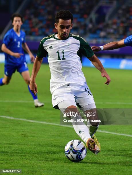 Ahmed Mazen A Alghamdi of the Saudi Arabia football team seen in action during the 19th Asian Games 2023 men's football group round Group B match...