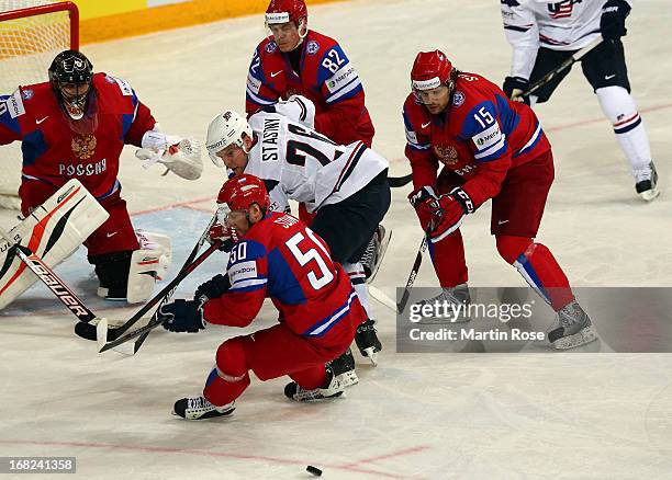 Sergei Soin of Russia and Paul Stastny of USA battle for the puck during the IIHF World Championship group H match between Russia and USA at Hartwall...