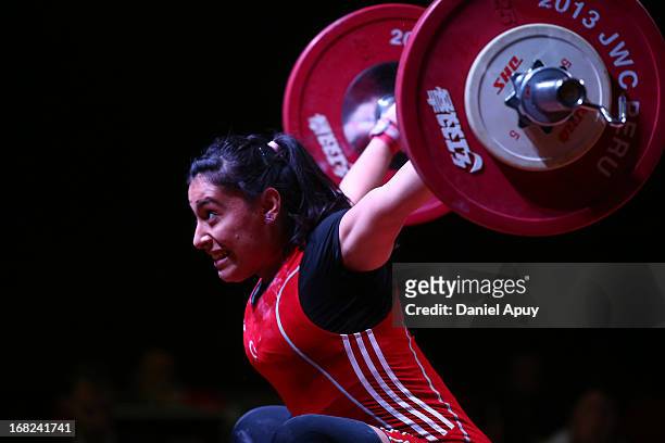 Mehtap Kurnaz of Turkey B competes in the Women's 63kg during day four of the 2013 Junior Weightlifting World Championship at Maria Angola Convention...