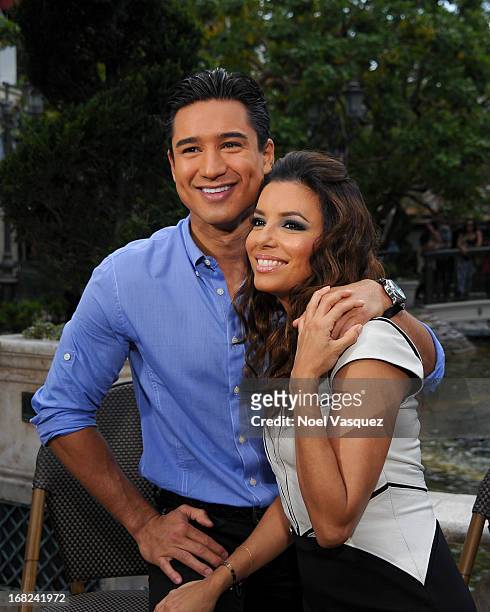Mario Lopez and Eva Longoria visit "Extra" at The Grove on May 7, 2013 in Los Angeles, California.