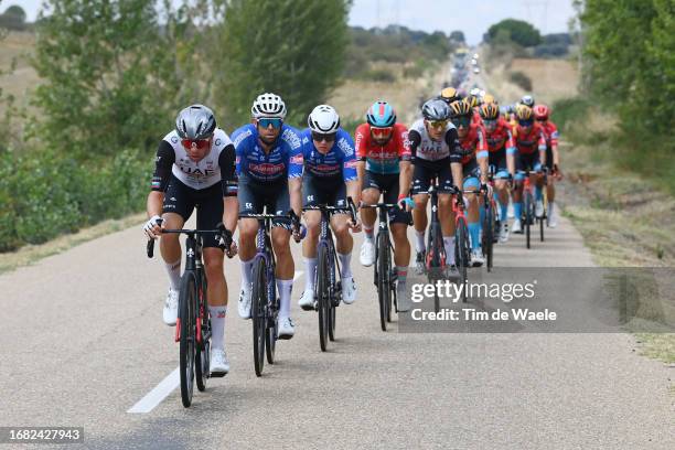 Domen Novak of Slovenia and UAE Team Emirates and Jimmy Janssens of Belgium and Team Alpecin-Deceuninck lead the peloton during the 78th Tour of...