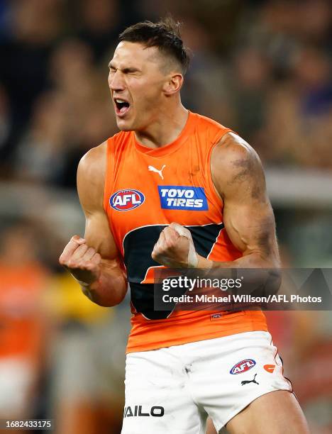 Isaac Cumming of the Giants celebrates a goal during the 2023 AFL First Preliminary Final match between the Collingwood Magpies and the GWS GIANTS at...