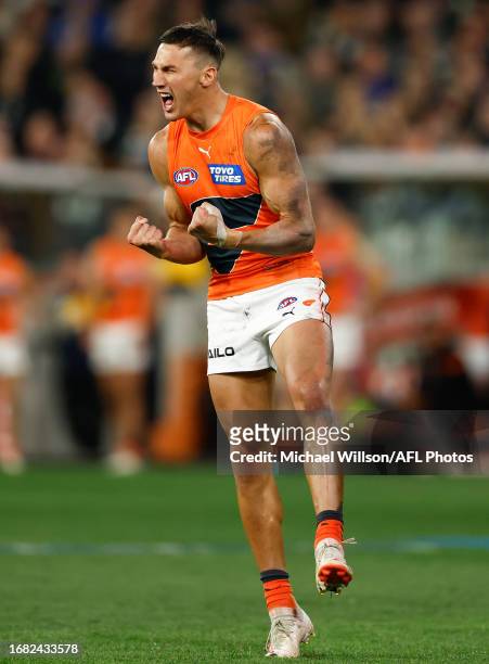 Isaac Cumming of the Giants celebrates a goal during the 2023 AFL First Preliminary Final match between the Collingwood Magpies and the GWS GIANTS at...