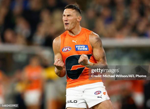 Isaac Cumming of the Giants celebrates a goal during the 2023 AFL First Preliminary Final match between the Collingwood Magpies and the GWS GIANTS at...