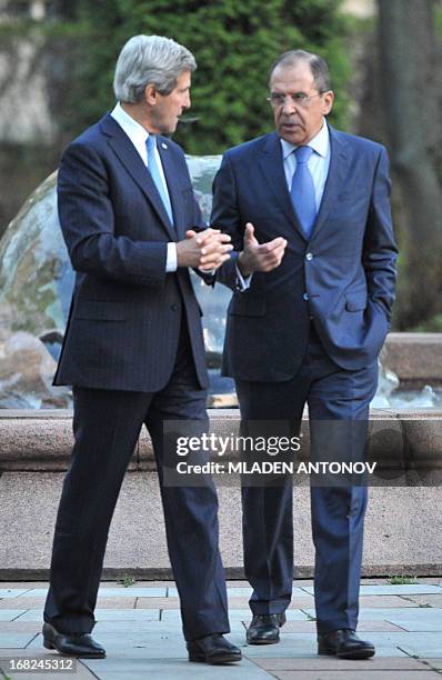 Secretary of State John Kerry and his Russian counterpart Sergei Lavrov discuss while taking a walk in the garden of the Foreign Ministry Osobnyak in...