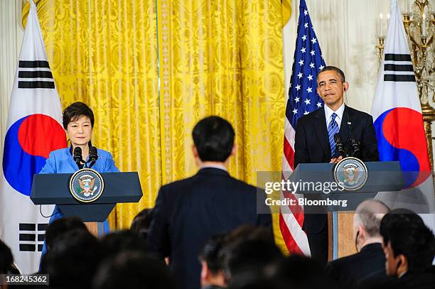 President Barack Obama, right, and Park Geun Hye, president of South Korea, listen to a question during a press conference in the East Room of the...