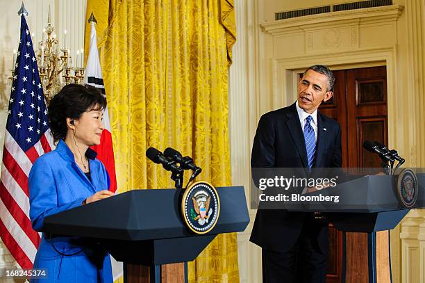 President Barack Obama, right, speaks as Park Geun Hye, president of South Korea, listens during a press conference in the East Room of the White...