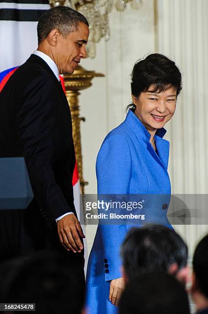 President Barack Obama, left, exits with Park Geun Hye, president of South Korea, after a press conference in the East Room of the White House in...