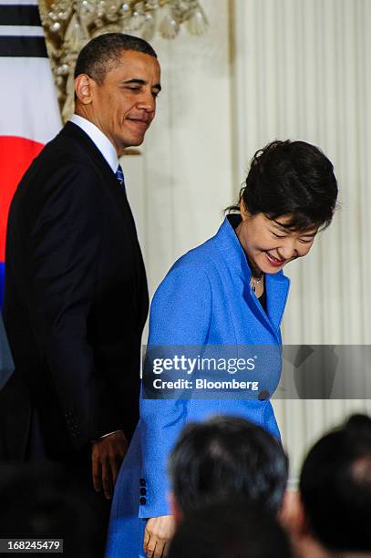 President Barack Obama, left, exits with Park Geun Hye, president of South Korea, after a press conference in the East Room of the White House in...