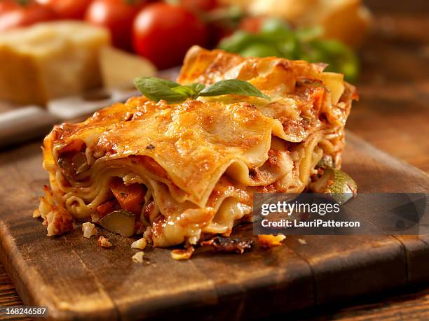 lasagna spring - serving lasagna stock pictures, royalty-free photos & images