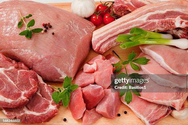 raw cuts of pork meat on a wooden chopping board - pork bildbanksfoton och bilder