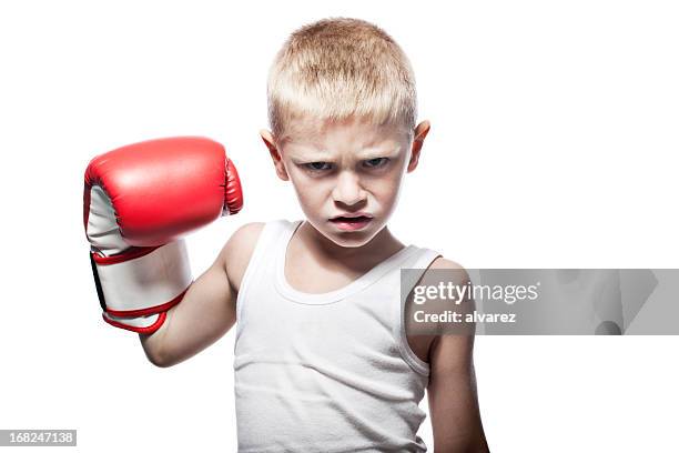 child showing his muscles with boxing gloves - kids boxing stockfoto's en -beelden