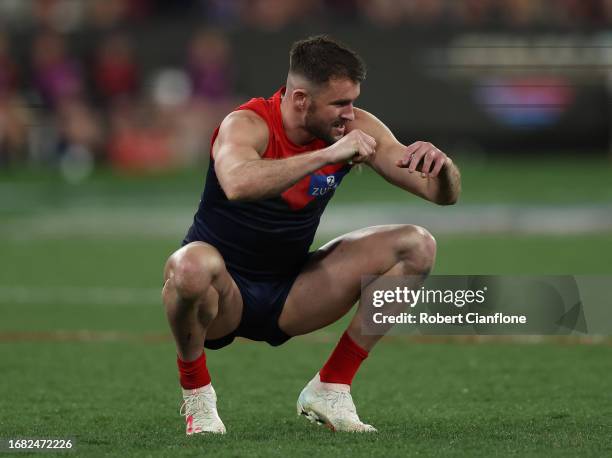 Joel Smith of the Demons is dejected after the Demons were defeated by the Blues during the AFL First Semi Final match between Melbourne Demons and...