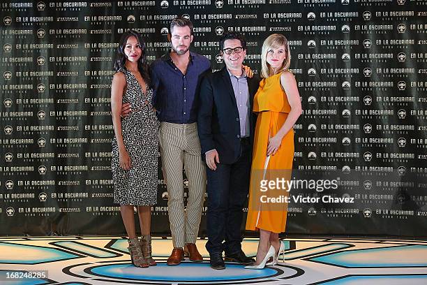 Actress Zoe Saldana, actor Chris Pine, film director J.J. Abrams and actress Alice Eve attend a photocall to promote the new film "Star Trek Into...