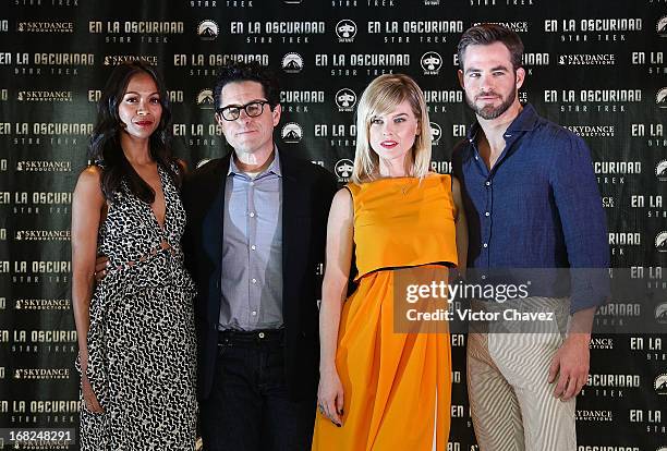 Actress Zoe Saldana, film director J.J. Abrams, actress Alice Eve and actor Chris Pine attend a photocall to promote the new film "Star Trek Into...
