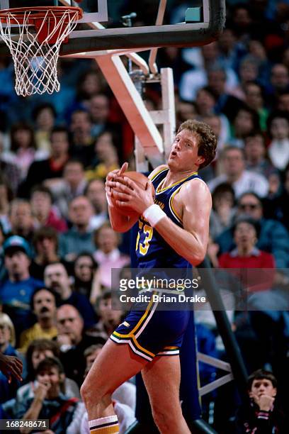 Mark Eaton of the Utah Jazz rebounds against the Portland Trail Blazers during a game played circa 1987 at the Veterans Memorial Coliseum in...