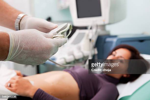 doctor is performing liver biopsy to  woman...supporting with ultrasound - biopsy stock pictures, royalty-free photos & images