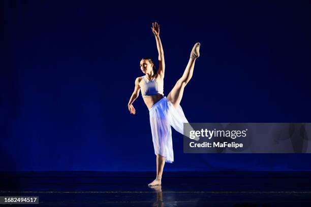 teenage girl dancing contemporary dance on stage - contemporary dance stock pictures, royalty-free photos & images