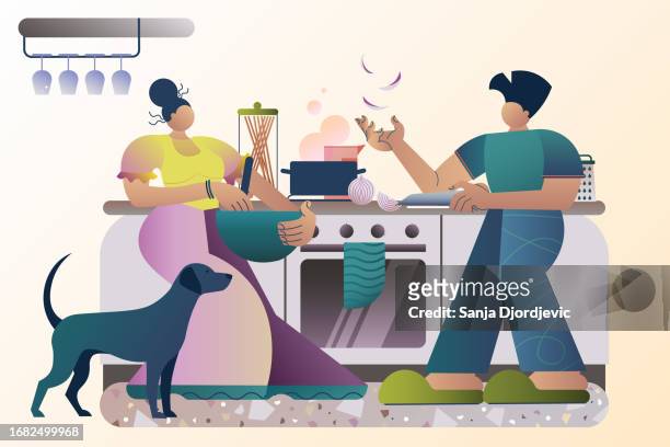 junges erwachsenes paar, das essen in der küche kocht - junges paar kochen in der küche stock-grafiken, -clipart, -cartoons und -symbole